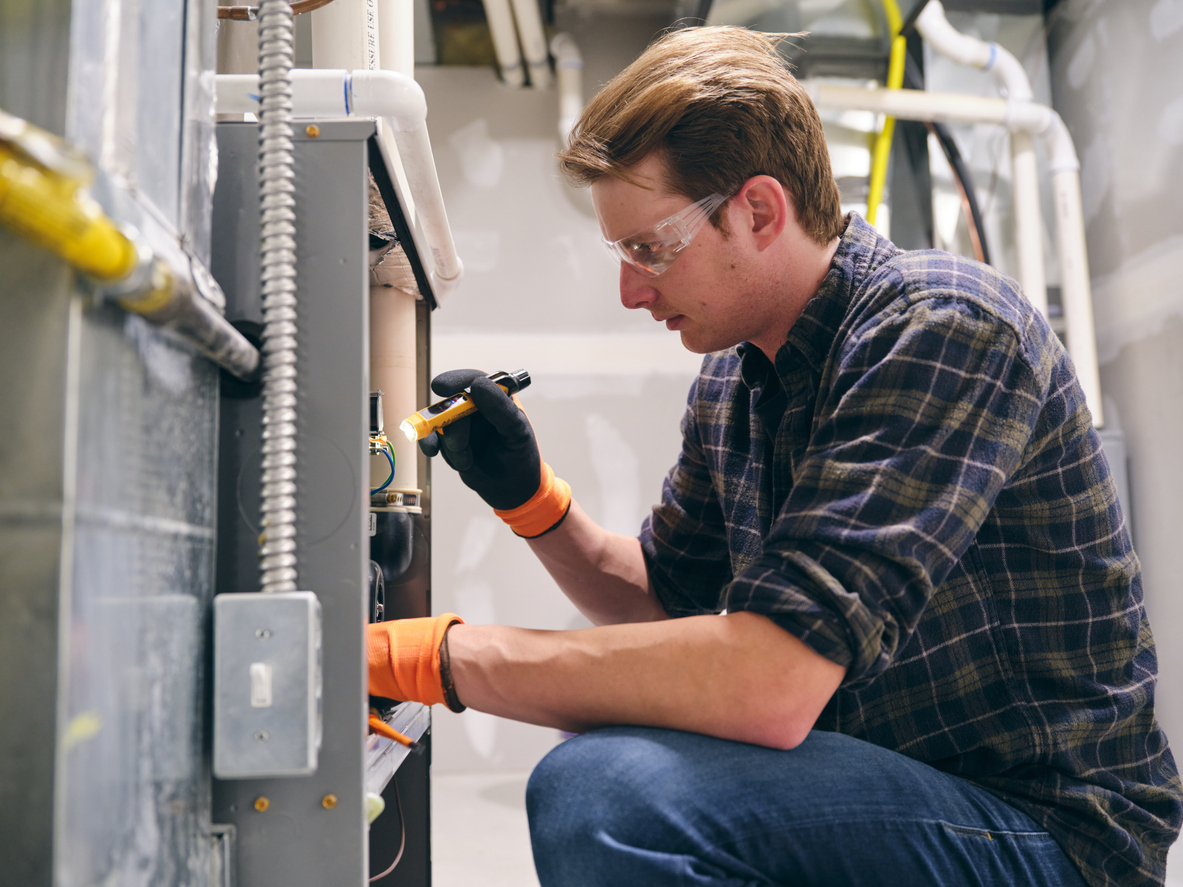 Repair Tech Working on Furnace