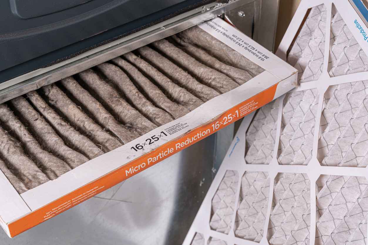 Replacing dirty air filter in home