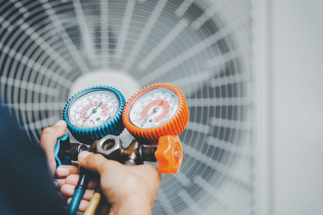 Technician Calibrating AC Unit