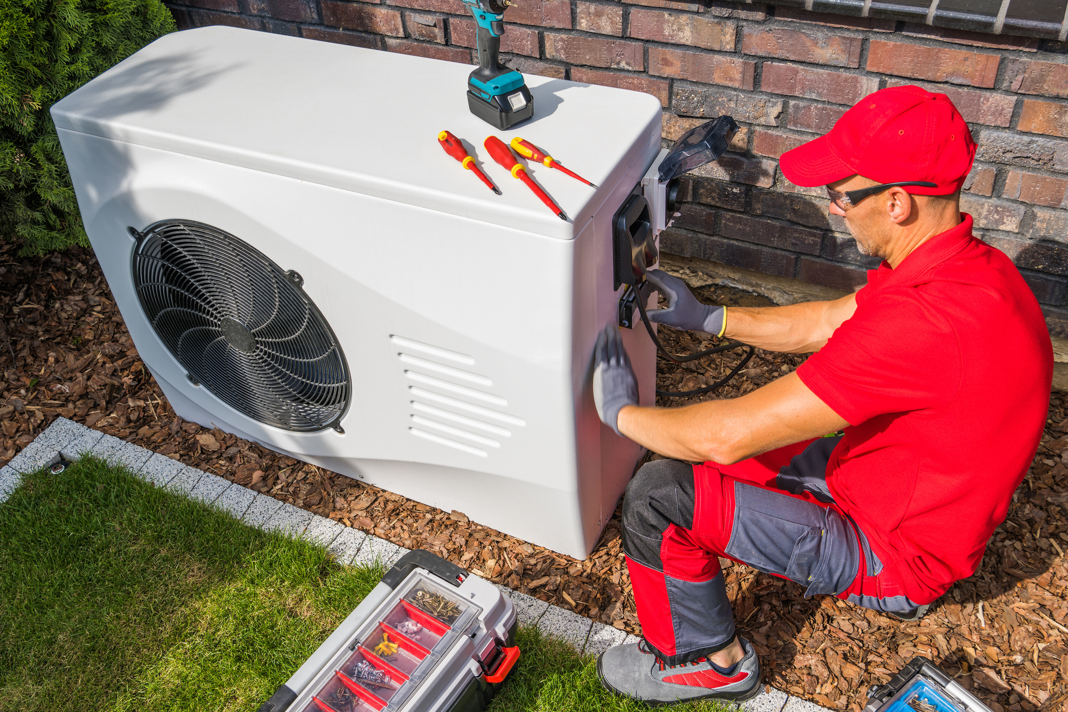 Technician Installing Heat Pump